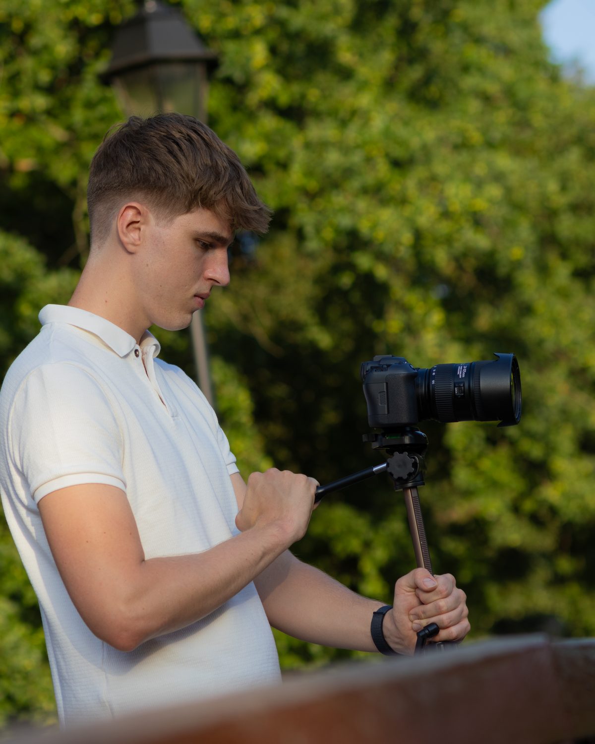 Pabolo filming with a camera on a tripod